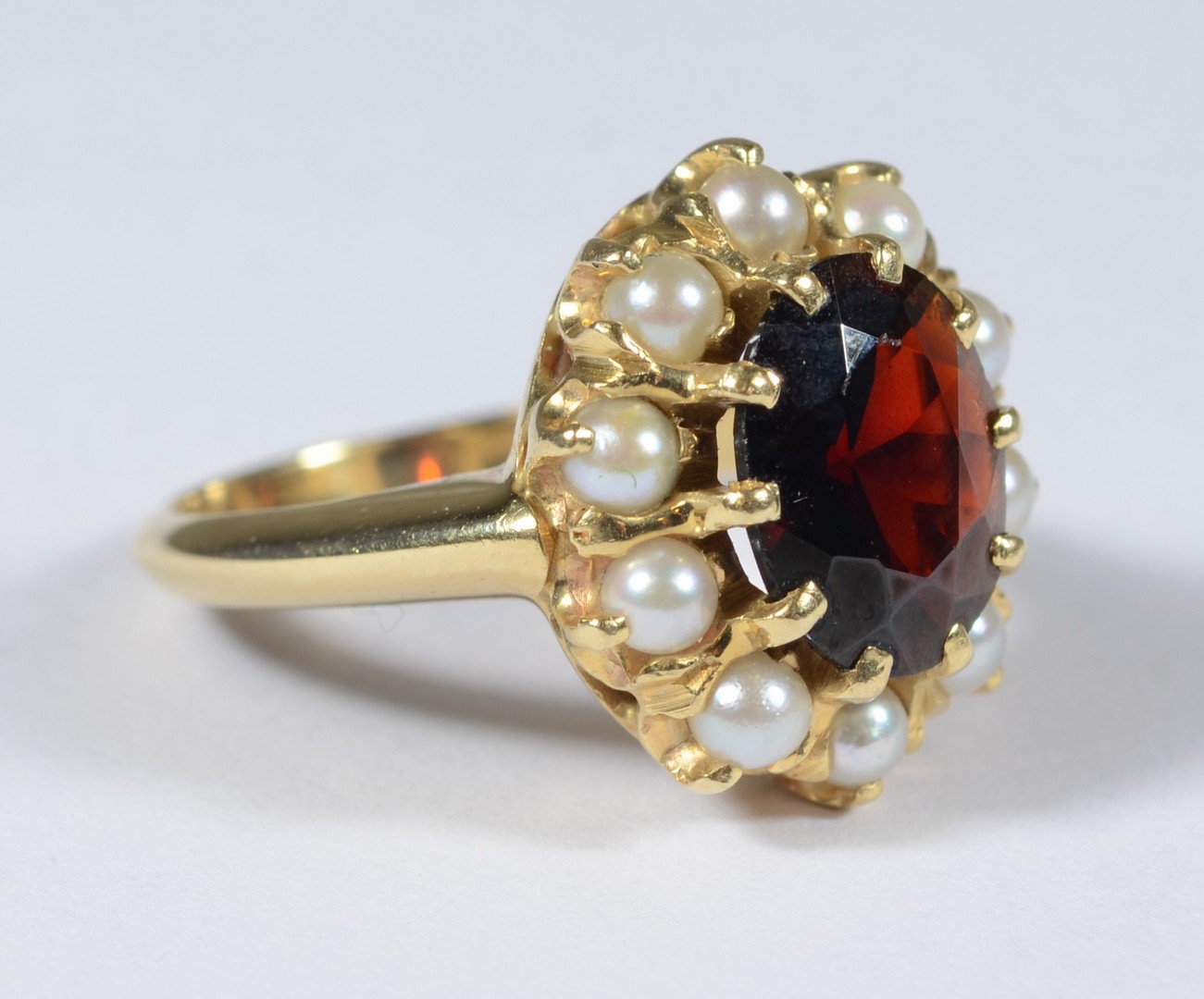 Appraisal: K YG oval garnet pearl ring mm x mm surrounded