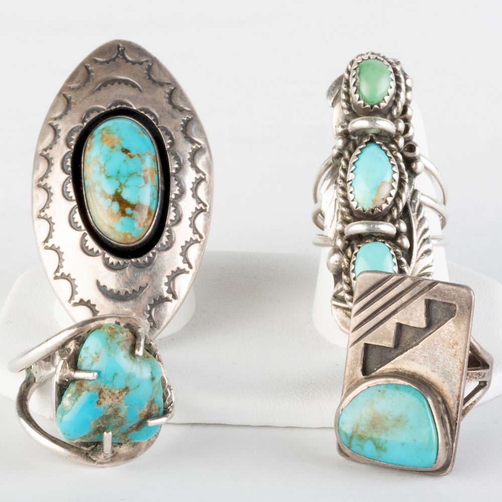 Appraisal: Four Native American Turquoise and Silver Rings Of different designs