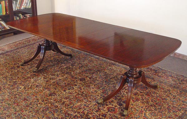 Appraisal: KITTINGER MAHOGANY DINING TABLE Model A Banded mahogany double pedestal