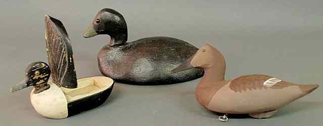 Appraisal: Three carved duck decoys one with a hinged back largest