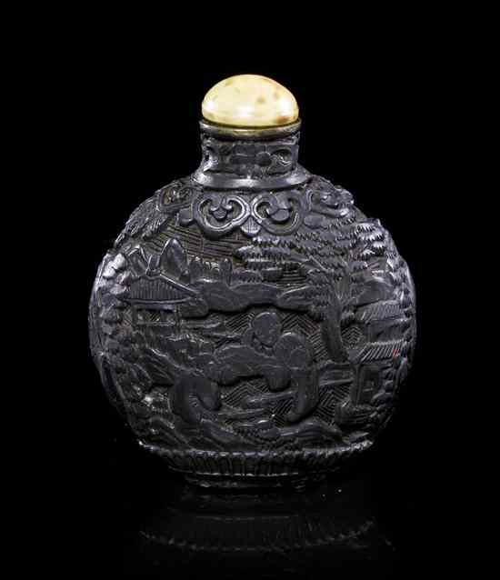 Appraisal: A Carved Black Lacquer Snuff Bottle of compressed globular form