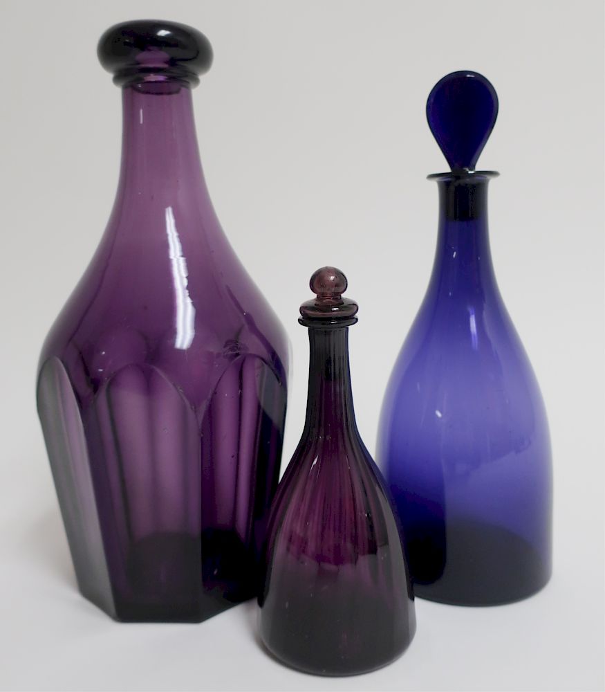 Appraisal: Three Amethyst Cologne Bottles th C Faceted small ribbed and