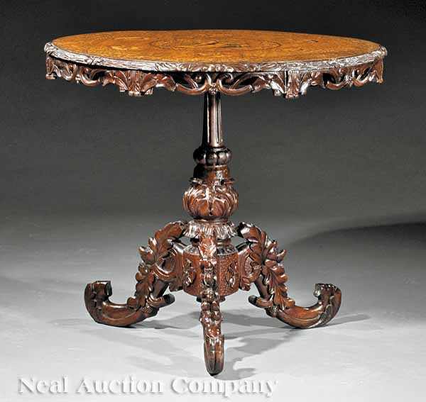 Appraisal: A German Carved and Inlaid Walnut Center Table th c