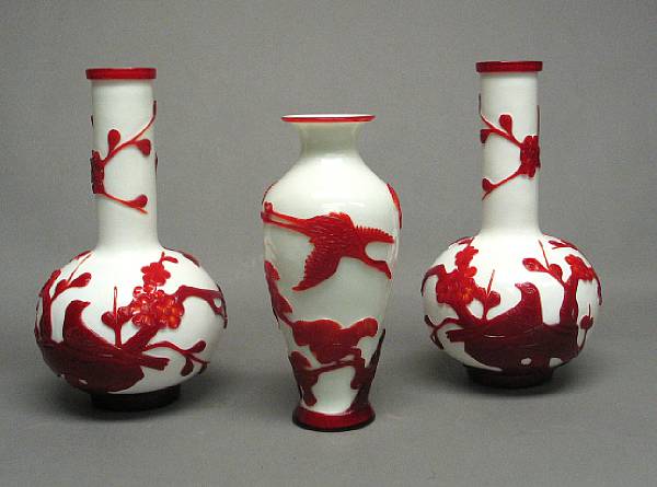 Appraisal: A group of three red-overlaid white Peking glass vases th