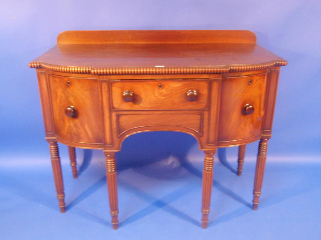 Appraisal: A William IV mahogany bow front sideboard with nulled moulded