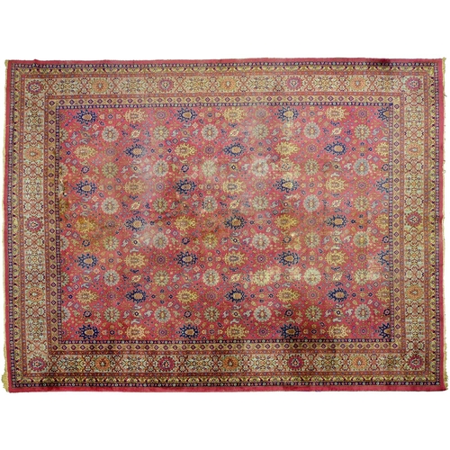 Appraisal: An antique Turkish carpet with pink ground first half th