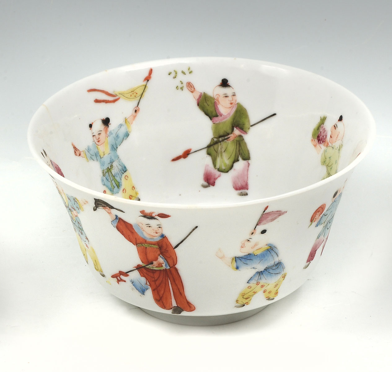 Appraisal: ENAMELED CHINESE YOUNG WARRIOR BOWL White ground Chinese bowl having