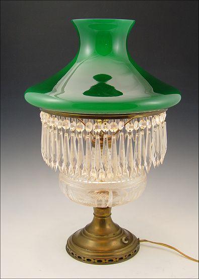 Appraisal: CUT GLASS OIL LAMP WITH CASED GREEN GLASS SHADE Converted