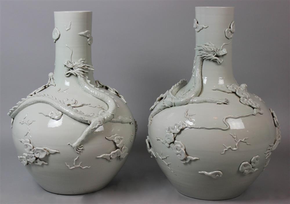 Appraisal: CHINESE PAIR OF PALE-GLAZED LARGE VASES each vase applied with