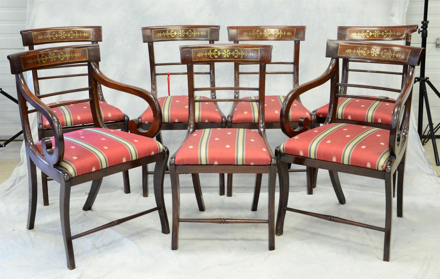 Appraisal: mahogany Regency dining chairs with brass inlaid tablets slip seat