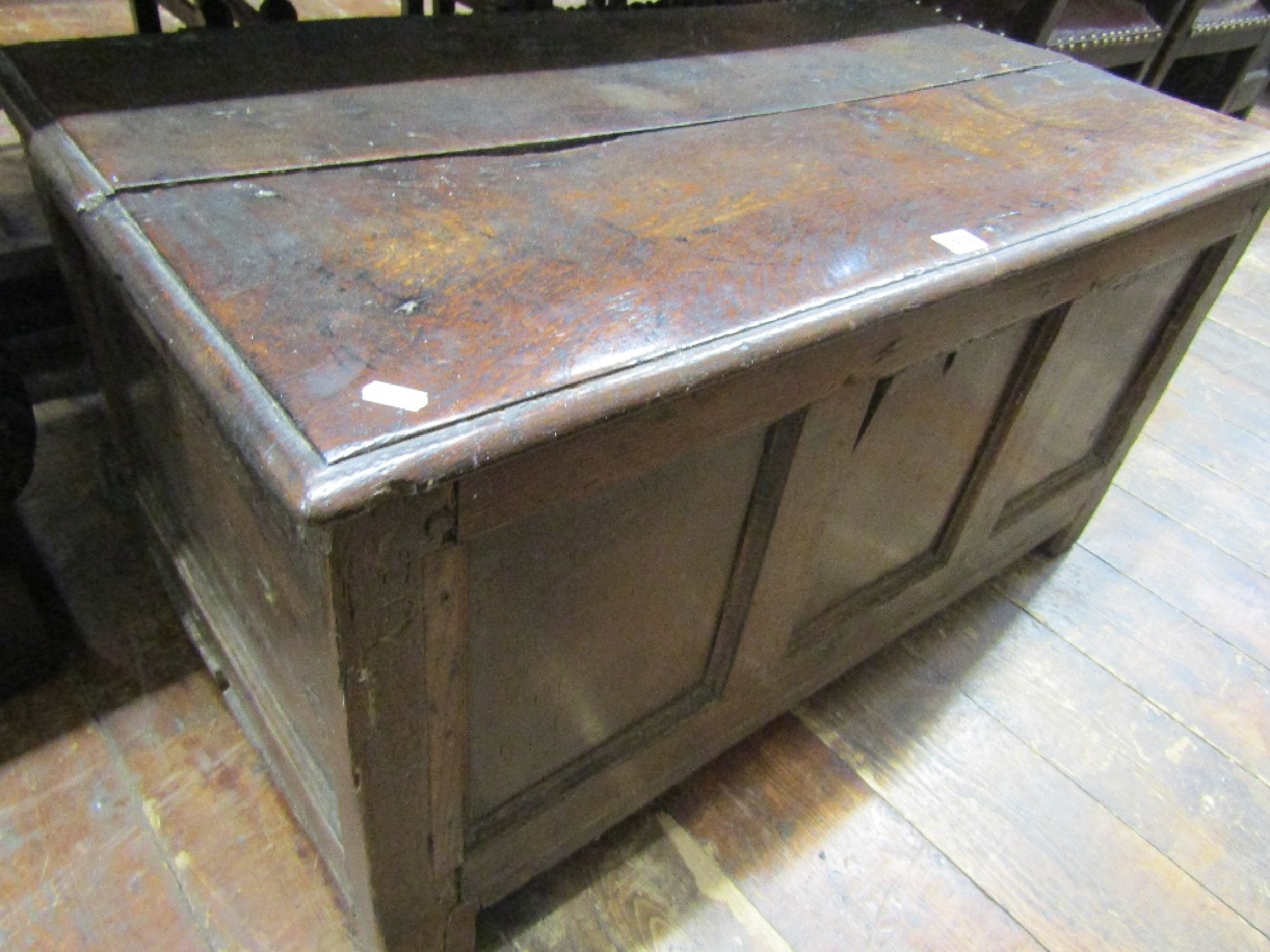 Appraisal: An th century oak coffer with panelled framework and flanked