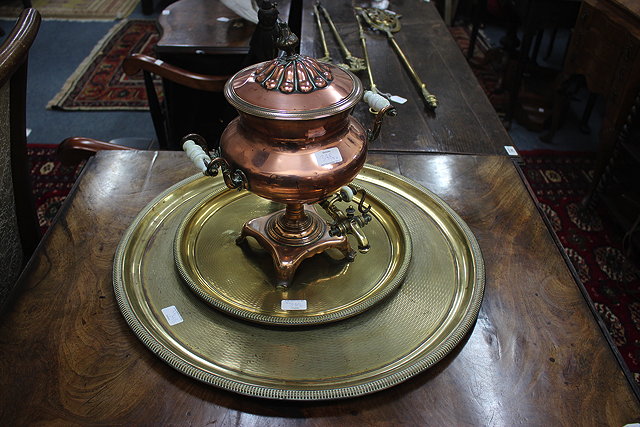 Appraisal: A COPPER SAMOVAR three brass circular trays the largest cm