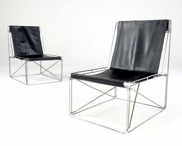 Appraisal: MAX SAUZE Lounge chairs with black leather seat on steel