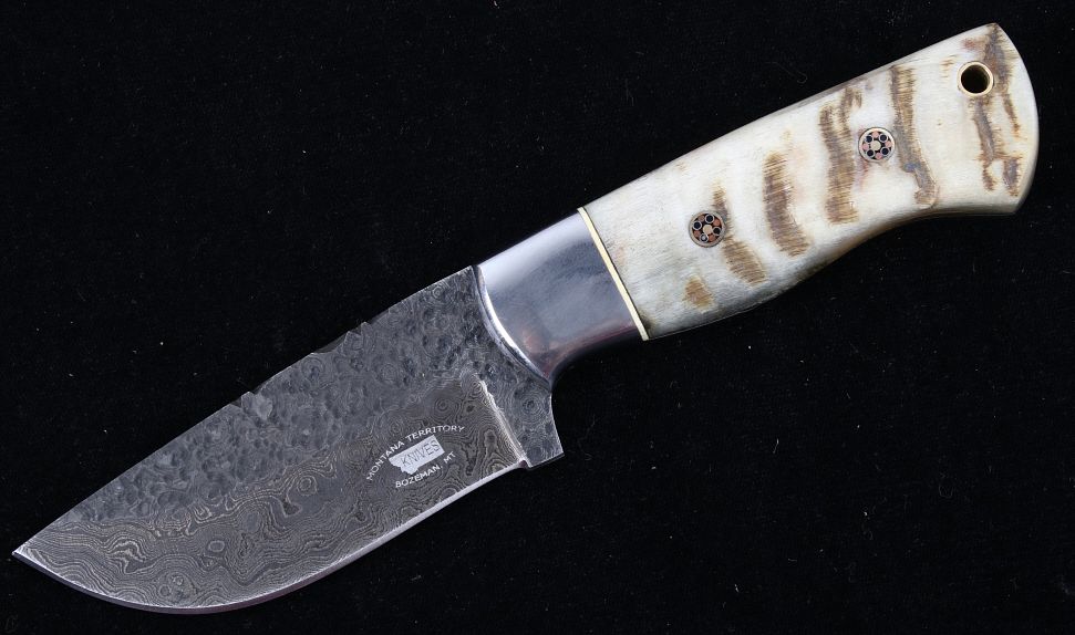 Appraisal: M T Knives Rams Horn Damascus Hammered Knife This is