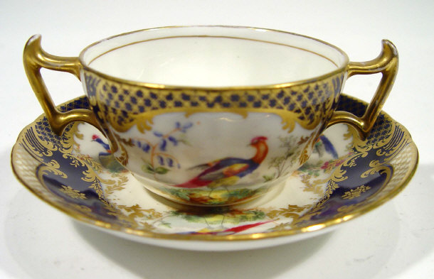 Appraisal: Royal Doulton two handled cup and saucer retailed by Tiffany