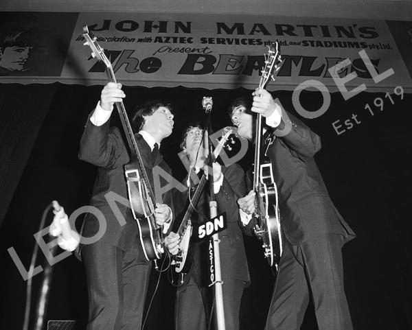 Appraisal: JOHN LENNON PAUL MCCARTNEY AND GEORGE HARRISON PERFORMING ON STAGE