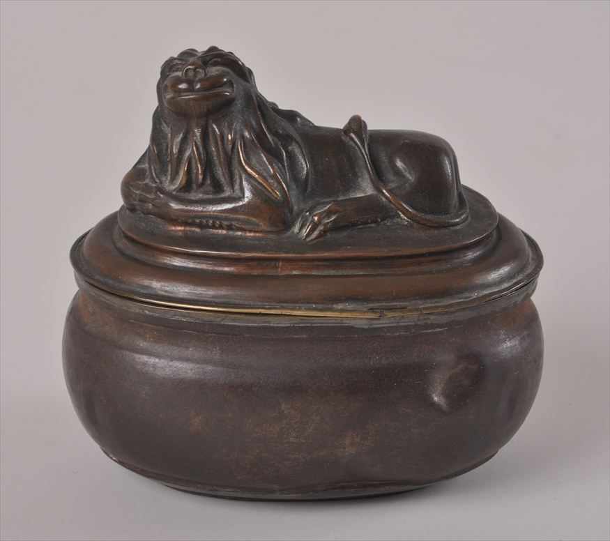 Appraisal: CONTINENTAL BRONZE PATINATED TIN TOBACCO BOX AND COVER POSSIBLY DUTCH