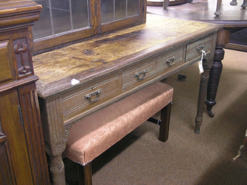 Appraisal: A Victorian walnut writing table fitted with three frieze drawers