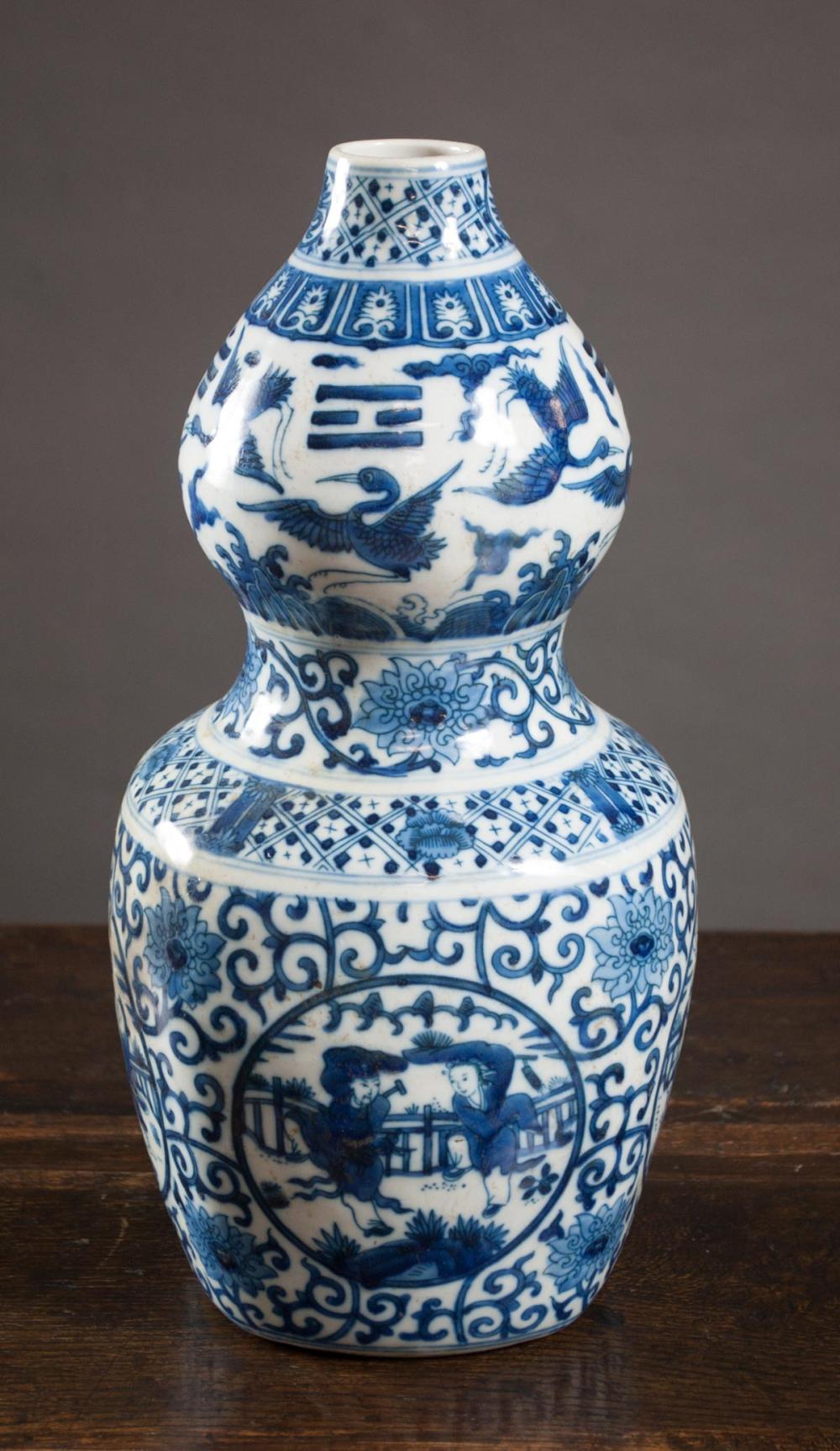 Appraisal: CHINESE MING STYLE BLUE AND WHITE PORCELAIN VASE gourd form