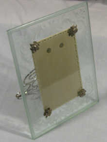 Appraisal: A silver mounted engraved glass photograph frame with silver Russian