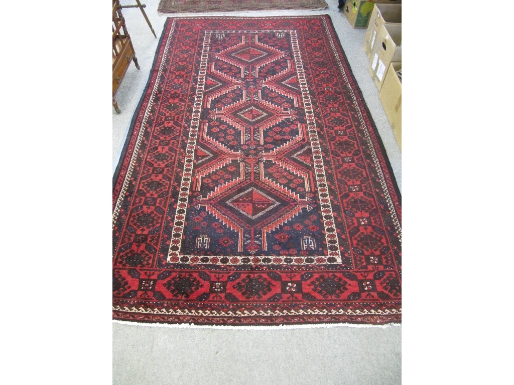 Appraisal: Iranian floor rug on a red white and blue ground