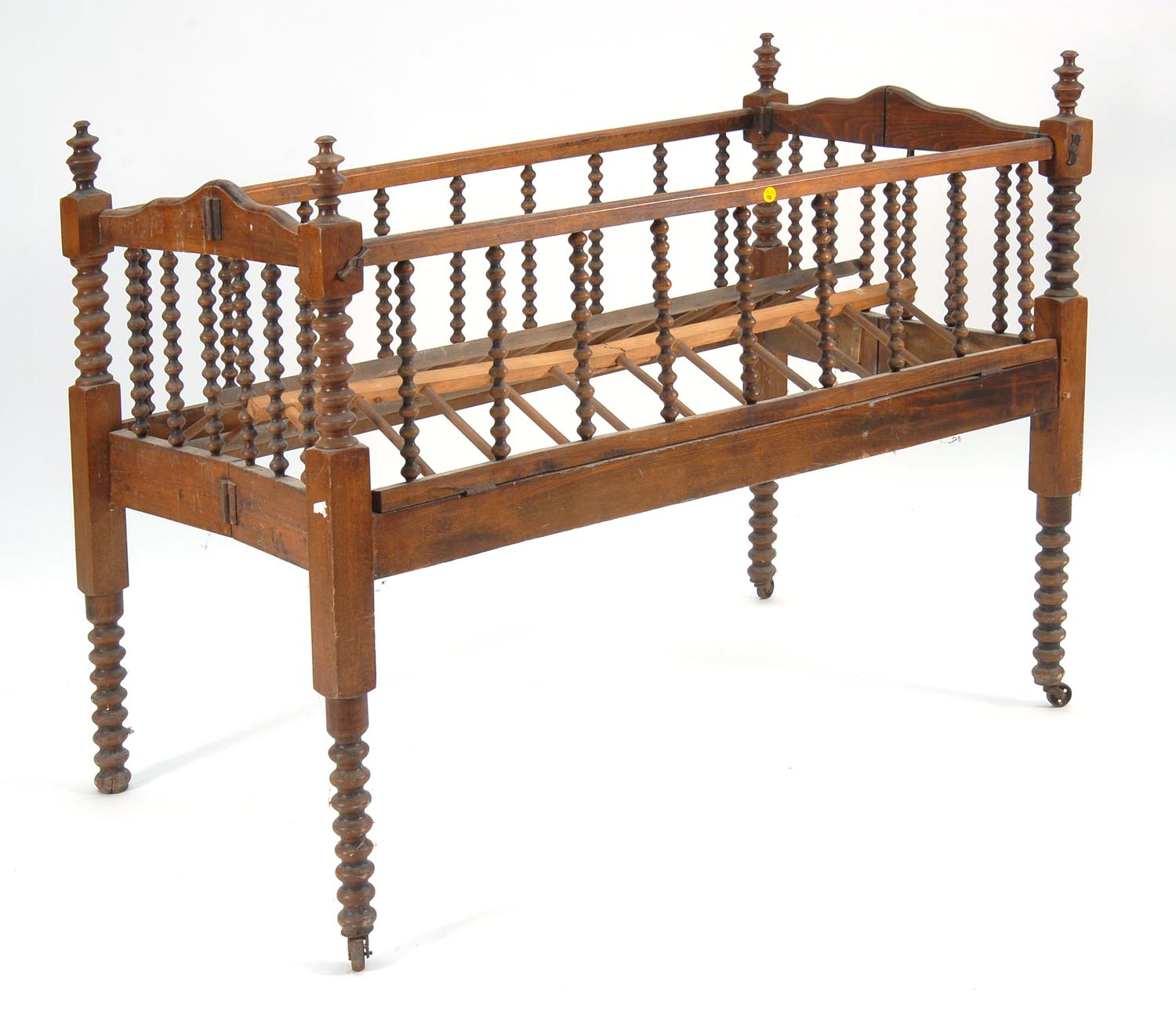 Appraisal: TH CENTURY SPOOL-TURNED FOLDING CRIB Height Length ConditionWear consistent with