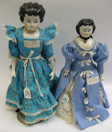 Appraisal: TWO GERMAN CHINA HEAD DOLLS one - molded black wavy