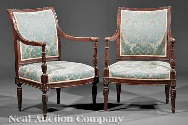 Appraisal: A Pair of Directoire-Style Carved Beechwood Armchairs the scrolled back