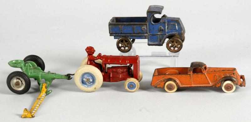 Appraisal: Lot of Cast Iron Vehicle Toys Description American Includes one