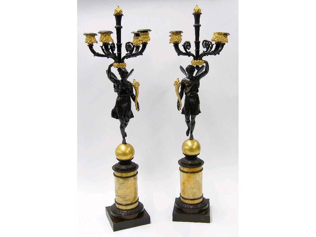 Appraisal: Fine pair of French bronze and ormolu candelabra modelled as