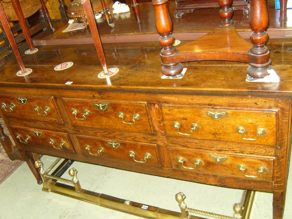 Appraisal: A Georgian oak dresser base fitted with an arrangement of