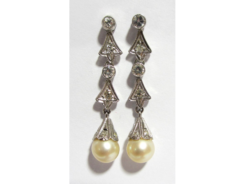 Appraisal: A pair of cultured pearl and diamond pendant earrings the