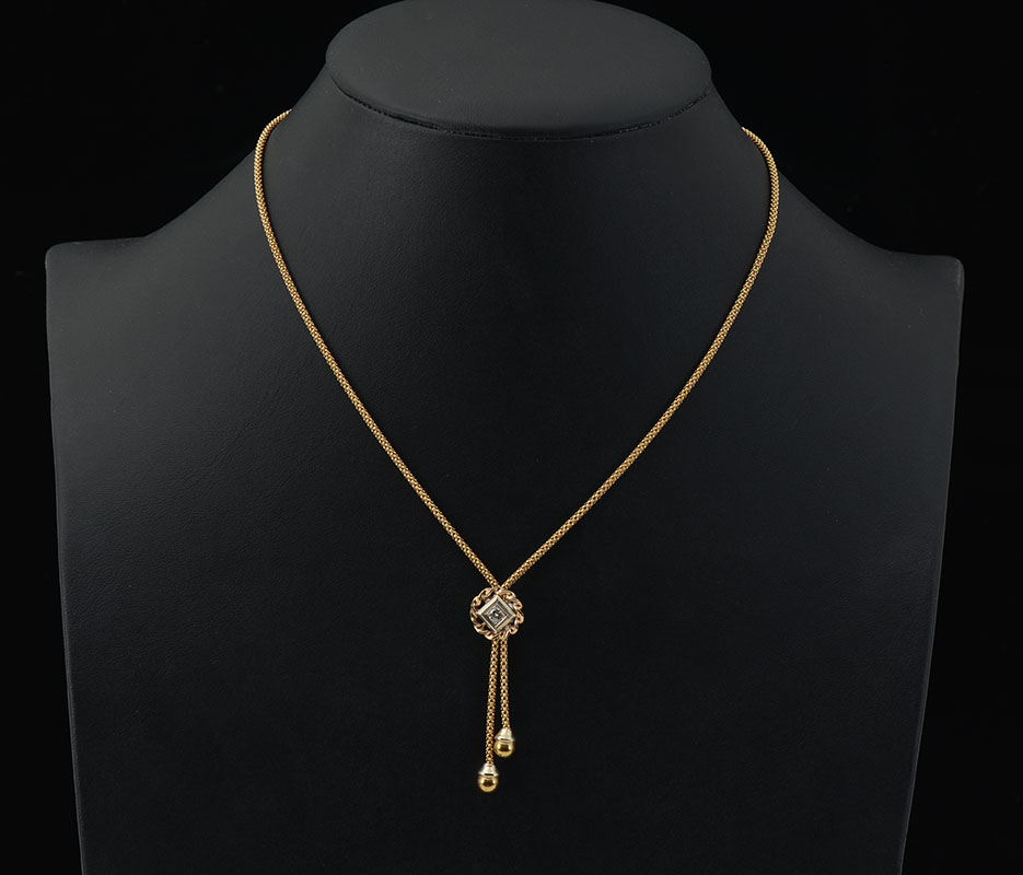 Appraisal: K DIAMOND BOLO NECKLACE K yellow gold bolo necklace with