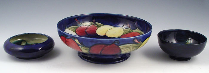 Appraisal: PIECE LOT OF MOORCROFT POTTERY All cobalt ground Pomegranate bowl