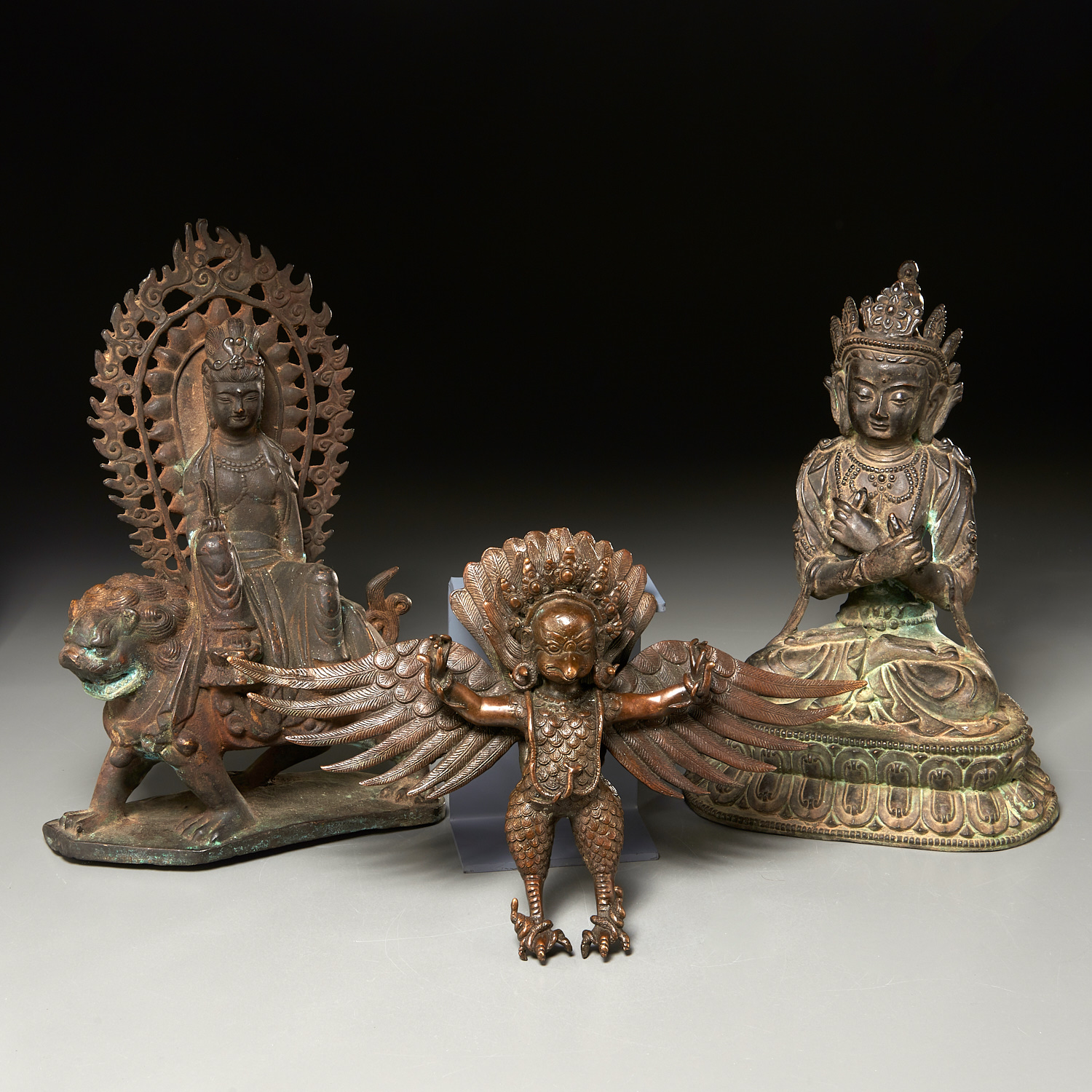 Appraisal: PAIR SINO-TIBETAN BUDDHAS AND GARUDA th th c Buddha riding