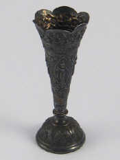 Appraisal: A flower vase of tapering form on domed base embossed