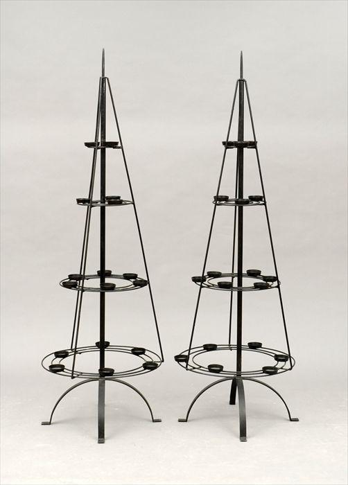 Appraisal: Pair of Black Enameled Votive Candle Trees in in diam