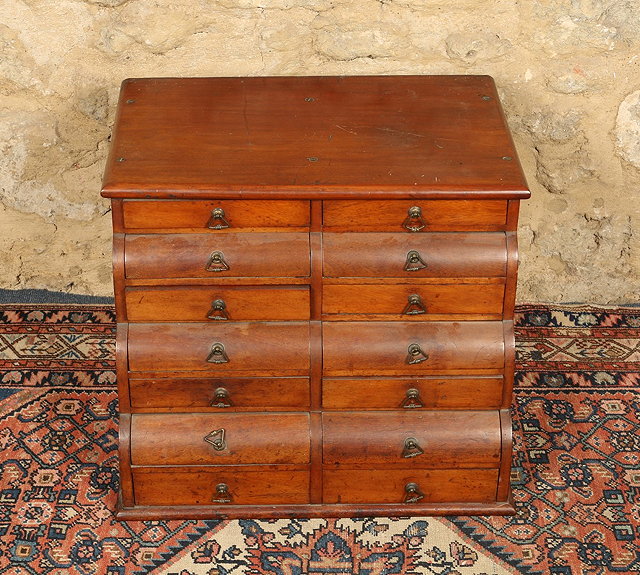 Appraisal: AN EDWARDIAN MAHOGANY TABLE TOP COLLECTORS CABINET fitted fourteen graduated