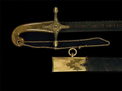 Appraisal: A hunting hanger the damascus blade with saw tooth edge