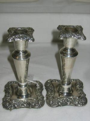 Appraisal: A VICTORIAN PAIR OF CANDLESTICKS the squared sconce on tapering