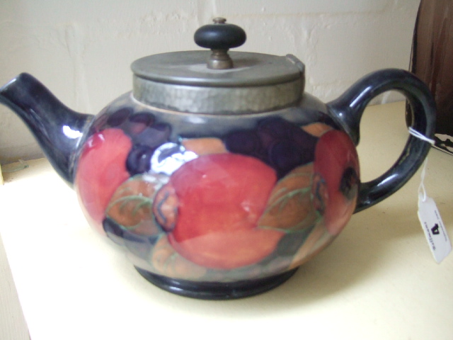 Appraisal: A Moorcroft teapot decorated in the 'Pomegranate' pattern and with