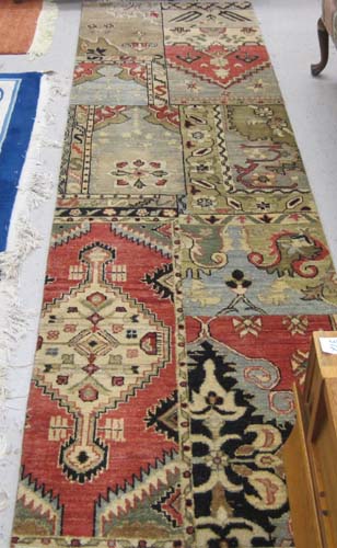 Appraisal: HAND KNOTTED ORIENTAL RUNNER Indo-Persian random panel design lacking borders