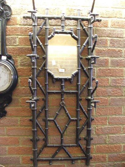 Appraisal: A VICTORIAN CAST IRON WALL MOUNTED COAT STAND of simulated