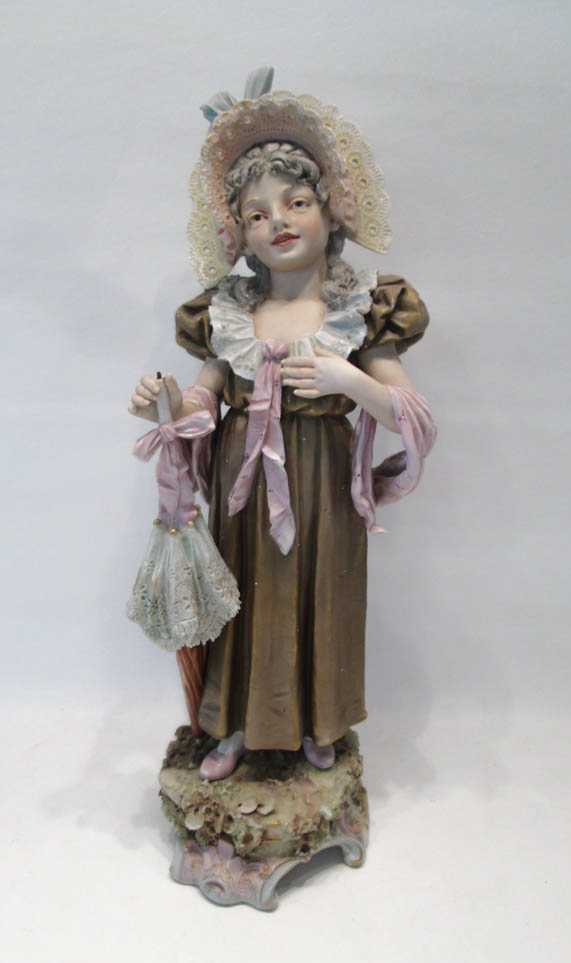 Appraisal: A BOHEMIAN ROYAL DUX PAINTED PORCELAIN FIGURE of a Victorian