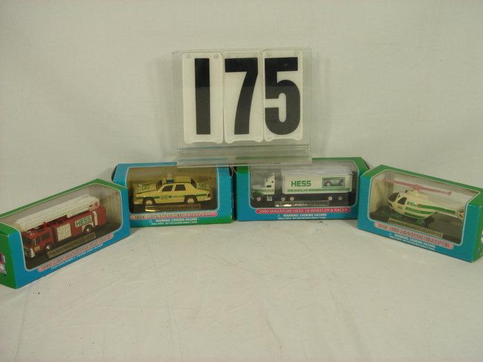 Appraisal: Lot of Miniature Hess Trucks Set of Wheeler Racer Helicopter