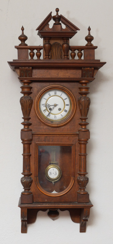 Appraisal: CARVED GERMAN WALL CLOCK Removable architectural pediment with spire finial