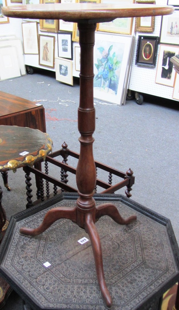 Appraisal: A th century mahogany candle stand the circular top on