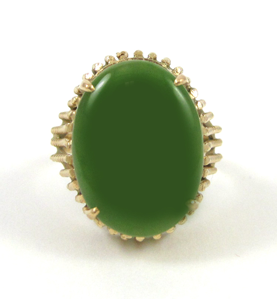 Appraisal: GREEN HARDSTONE AND FOURTEEN KARAT GOLD RING set with an