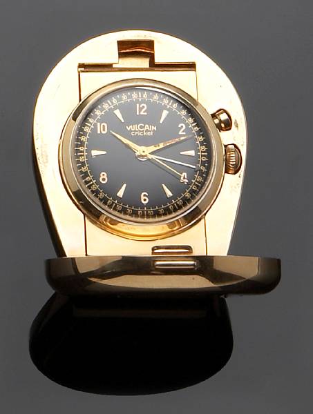 Appraisal: A gold travel clock and a curb link bracelet slider