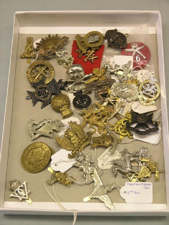 Appraisal: Thirty-six military cap badges various regiments some contemporary some re-strikes